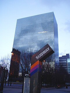 [Reflective PSE&G building beyond subway entrance]