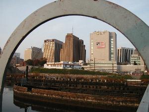 [Skyline seen thru top loop of bridge ladder]