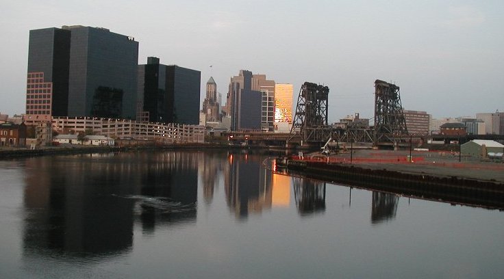 [Nwk skyline reflected at dawn]